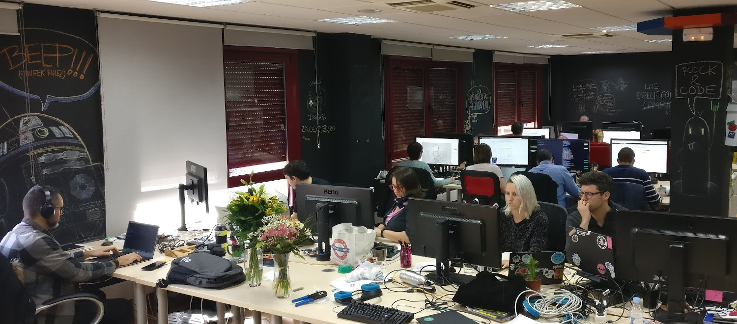 Kaleidos office with several people at their desks working
